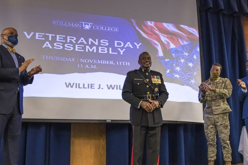 A black marine is honored during a veterans day ceremony