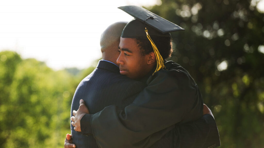 graduate hugging dad