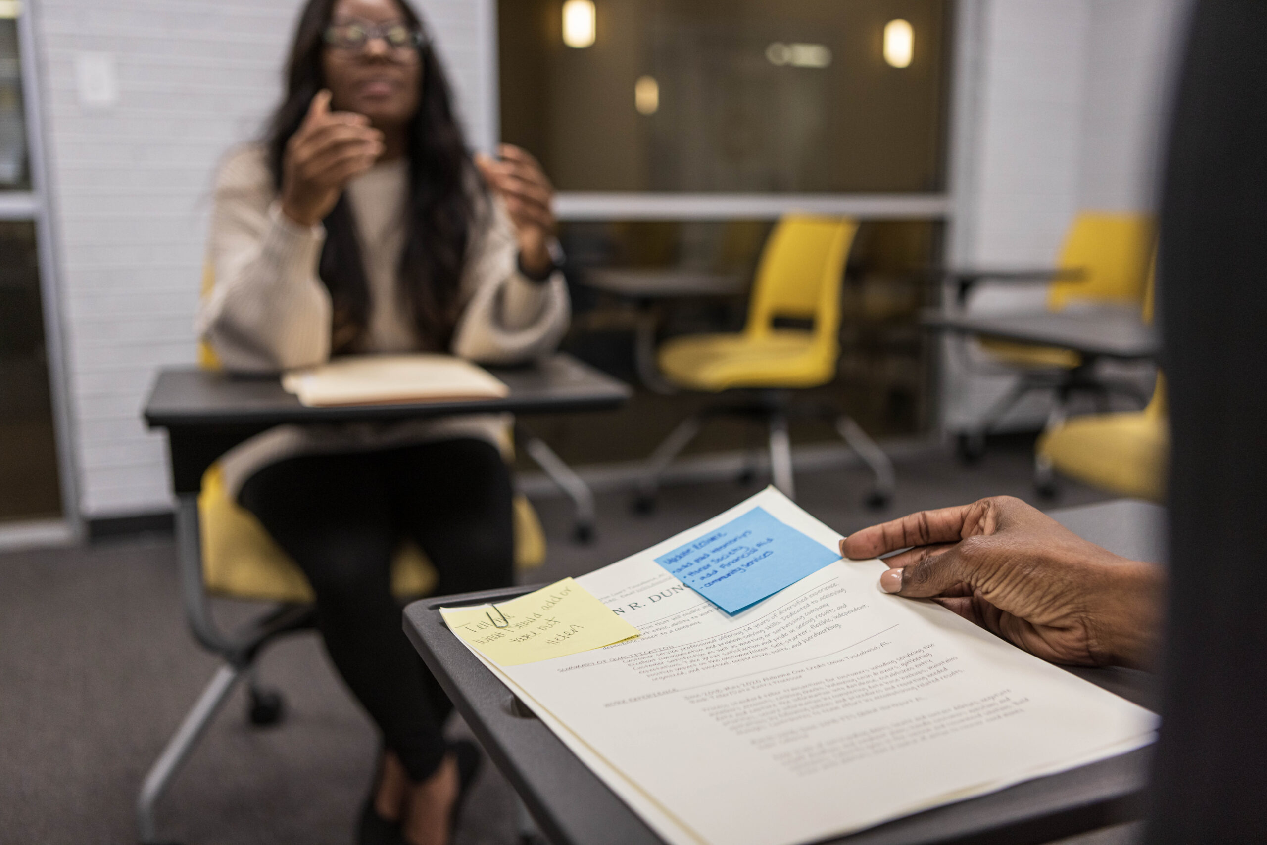 A black female college student participates in a mock job interview