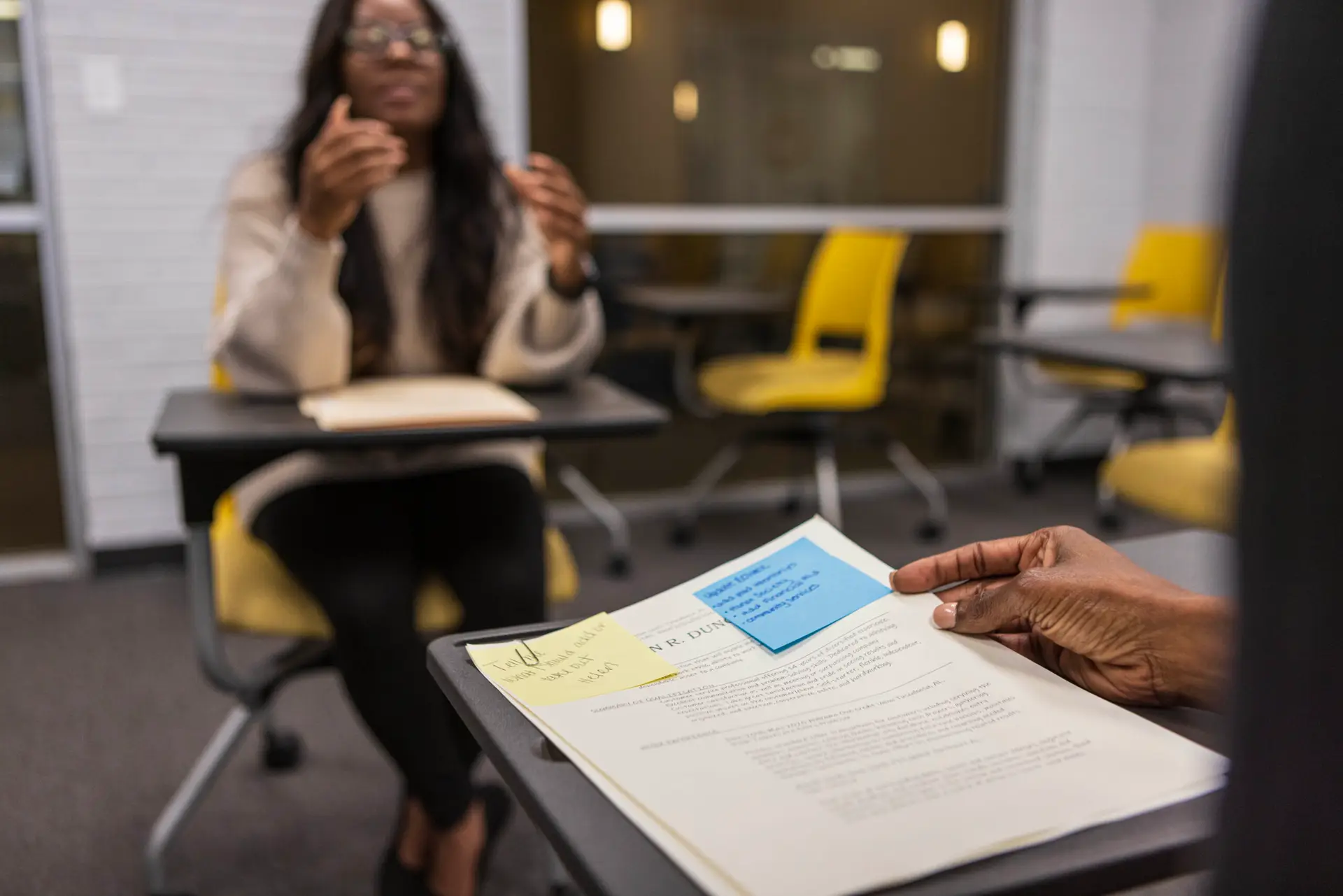 A black female college student participates in a mock job interview
